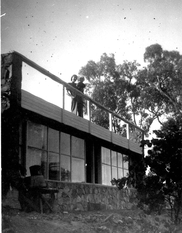 Molly holding Jay standing on sundeck. Warrandyte. C1947